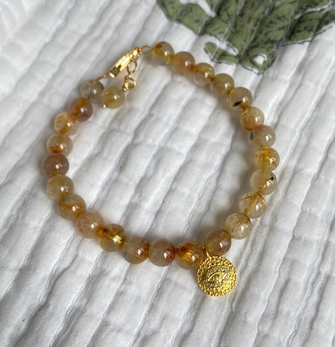 Golden Rutilated Quartz Bracelet with White Diamond Pavé Evil Eye Charm